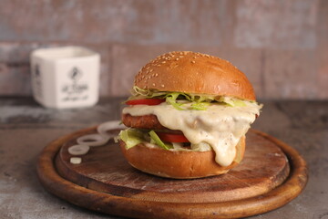 Homemade cheeseburger on an upscale table for lunch and dinner