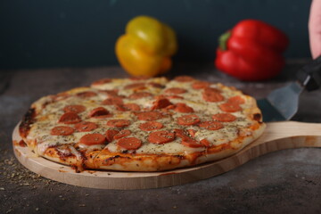 Delicious pizza with a sophisticated background of cheese and vegetables