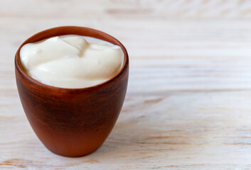 Fresh sour cream in a bowl