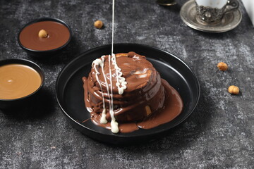 Delicious Cinnabon painted on a dark black background