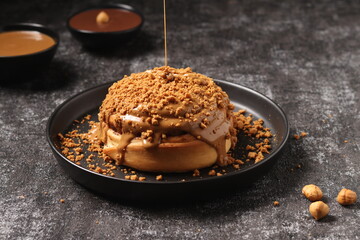 Delicious Cinnabon painted on a dark black background