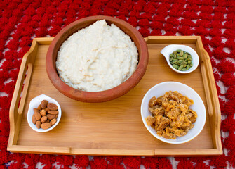 Kheer, Payasam, Phirni or rice pudding in earthen bowl. Healthy and home made dessert made with rice, milk and jaggery. It is very famous sweet dish of India.