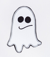 Funny paper ghost with eyes and mouth smiling on a white background, top view