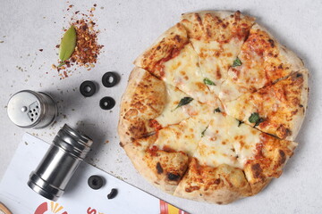 Delicious pizza with a sophisticated background of cheese and vegetables