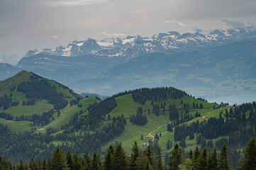 Mountain landscape of Switzerland in summer with snowy hills