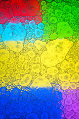 Bubbling liquid on varicolored background