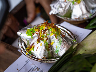 Banarasi paan, betel nut garnished with all indian banarasi ingredients on paan ready to sale.