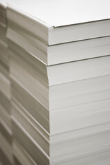 Stack of cut white paper ready to print.