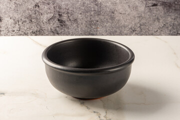 Pot on white marbled background. Isolated