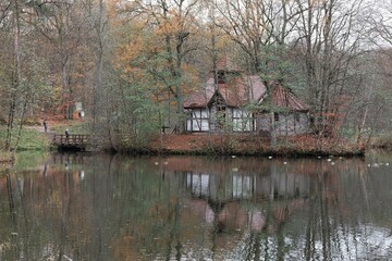 Obraz premium Chapel on water in Charlotta Valley near Ustka, Poland. Charlotta Valley is known for its Rock Legend Festival