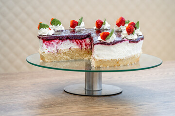 fruit cake with marmalade and whipped cream