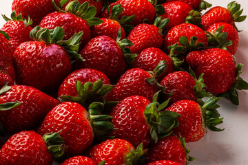 Strawberries on marbled background on gray background