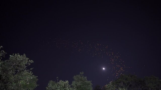 Thai people release floating lanterns to worship the Buddha's relics during the Loi Krathong and Yi Peng Lanna festivals. Celebration. in the night of the full moon
