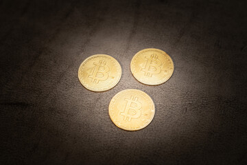 Crypto Coins shining on dark leather bitcoin Ethereum