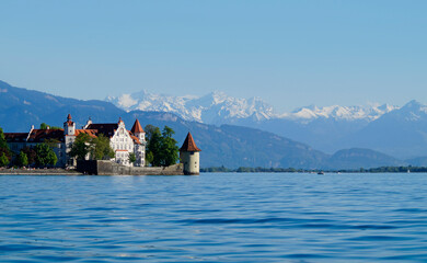 the beautiful island of Lindau on lake Constance (lake Bodensee) with the snowy Swiss Alps in the...