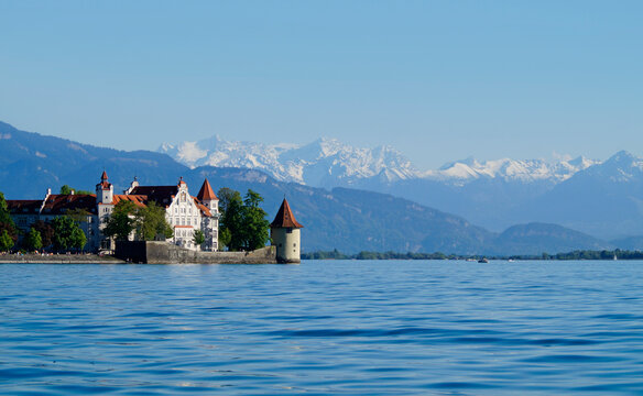 the beautiful island of Lindau on lake Constance (lake Bodensee) with the snowy Swiss Alps in the background, Germany on fine sunny spring day