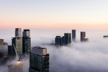 Toronto city skyline above fog © Kevin