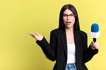 feeling happy, surprised realizing a solution or idea. journalist or presenter with a micro