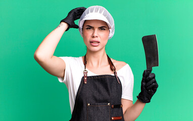 feeling stressed, anxious or scared, with hands on head. butcher with a knife concept