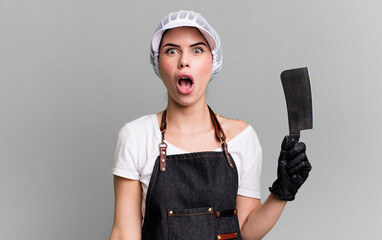 looking very shocked or surprised. butcher with a knife concept