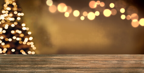 Christmas empty wooden table and golden bokeh lights