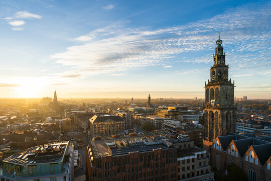 The sun setting over the historical city centre of Groningen and the Martinitoren on a beautiful afternoon.