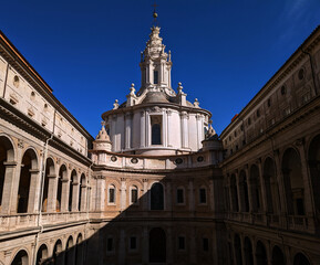 Fototapeta na wymiar Facade of the San'Ivo complex with the diagonal signs of the shadows, Sant'ivo alla Sapienza, Rome, Lazio, Italy