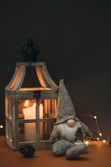 Cute dwarf next to a flashlight with a candle in retro style