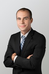 Smiling young business man posing