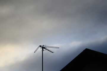 Local TV antenna on blank sky background
