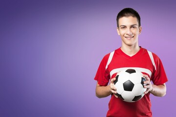 Young happy male fan support team with soccer ball