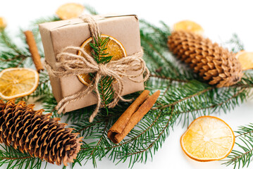Gift box with natural Christmas decoration. New Year gift.
