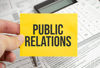 public relations words on paper notebook with pen