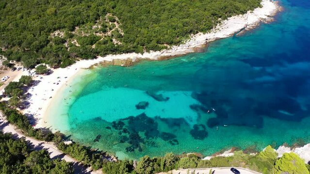 Aerial drone video of exotic paradise beach of Emblisi with turquoise and emerald clear sea near iconic Fiskardo bay, Cefalonia island, Ionian, Greece