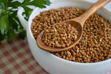 Dry buckwheat, parsley on old background