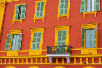 Obraz premium Colourful Exterior of Building with windows and balcony in Monaco