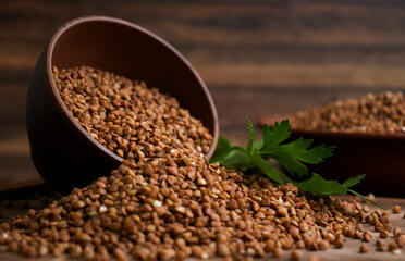 Dry buckwheat, parsley on old background