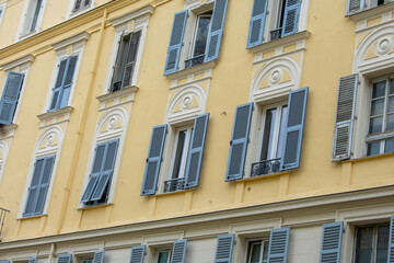 Obraz premium Colourful Exterior of Building with windows and balcony in Monaco
