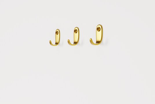 Hangers on a light wall. Minimalist concept, hanging towels, clothes on hangers. 3D render, 3D illustration.