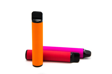 Set of colorful disposable electronic cigarettes isolated on white background. The concept of modern smoking, vaping and nicotine.