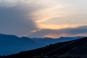 Magical purple and pink sunrise or sunset in the mountains