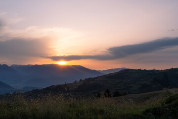 Obraz premium Magical purple and pink sunrise or sunset in the mountains