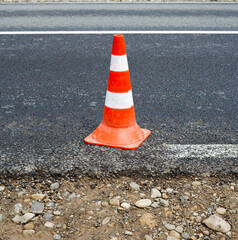Traffic cone on the road.
