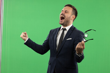 Young happy business man portrait on green screen background in studio
Suitable for editing and photo manipulations - Powered by Adobe