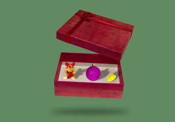 opened package, it contains reindeer, ornament and flowers, a creative holiday concept
