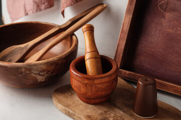 Wooden cooking utensils on white background, closeup
