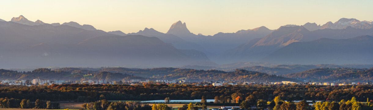 Panoramic view of Pau and the Pyrenees (Pic du Midi d'Ossau) during automn season and at sunrise. B&eacute;arn / France