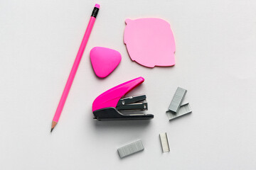 Set of stationery with stapler on light background