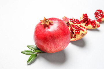 Fresh ripe pomegranates on white background