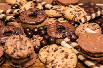 Dark and milk chocolate products and biscuits